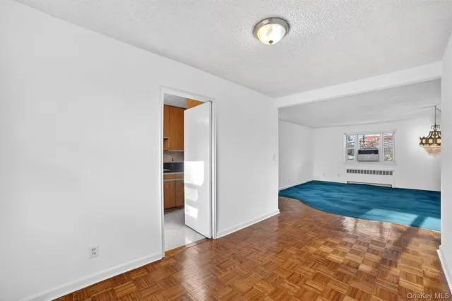 an empty room with closet and wooden floor