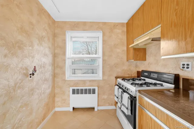 a kitchen that has a stove and a microwave