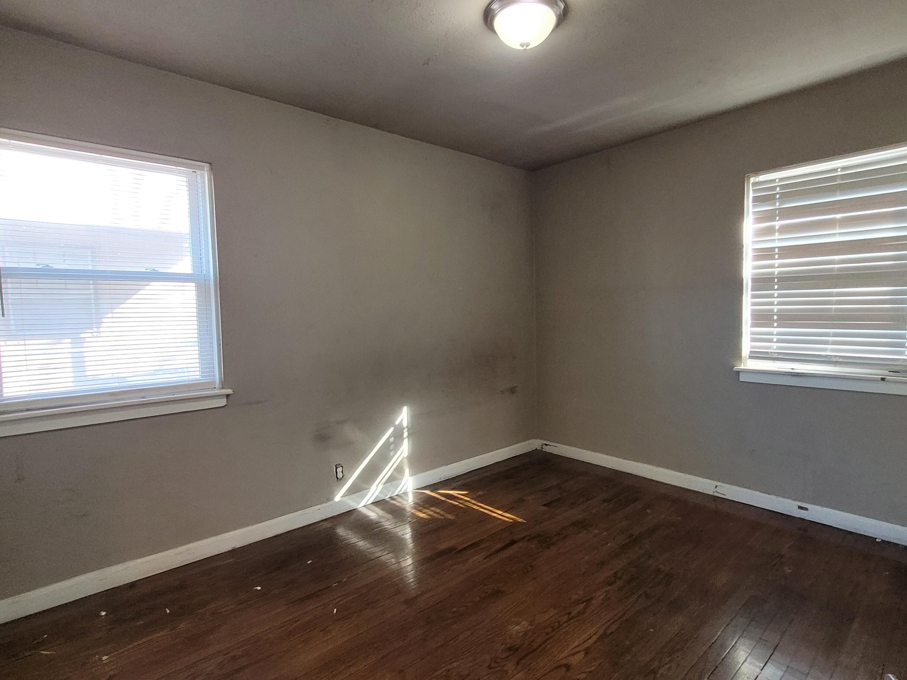 231 Taft Place Gary, IN 46404 - Photo 7 of 14 a room with wooden floor and windows