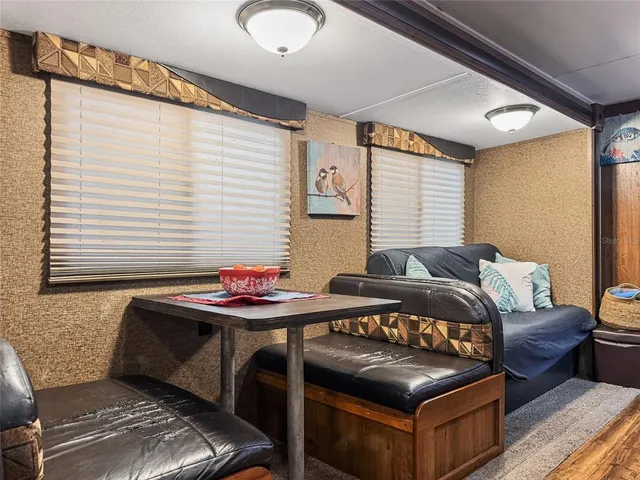 a bedroom with furniture and a window