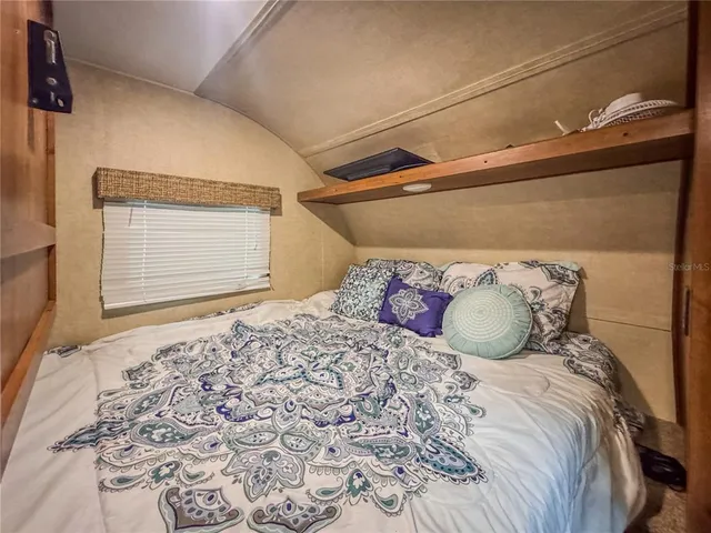 a room with a bed and a window