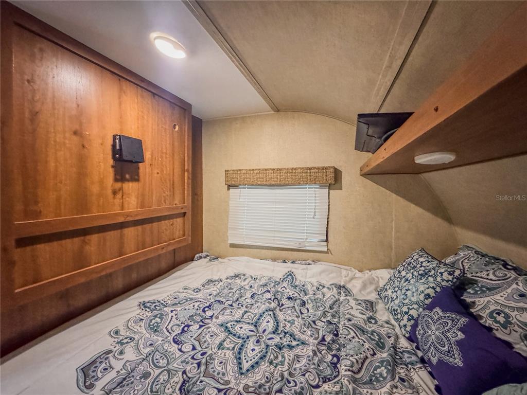 25184 Northeast 143rd Place Salt Springs, FL 32134 - Photo 22 of 42 a room with a bed and a window