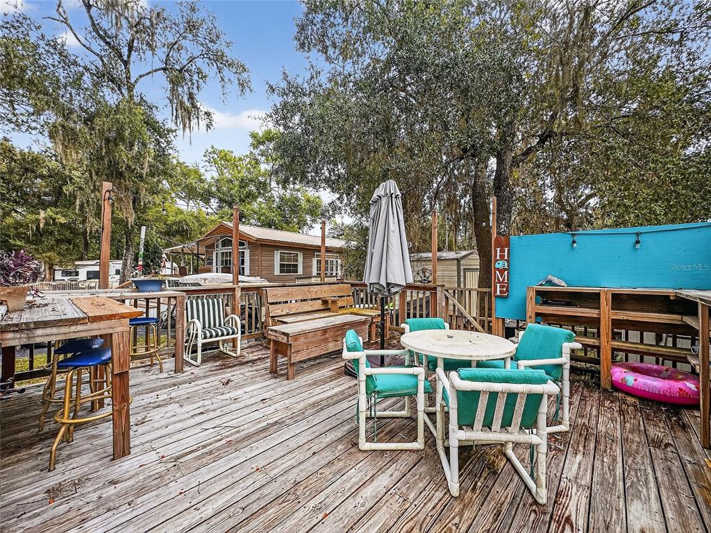 25184 Northeast 143rd Place Salt Springs, FL 32134 - Photo 24 of 42 an outdoor space with seating