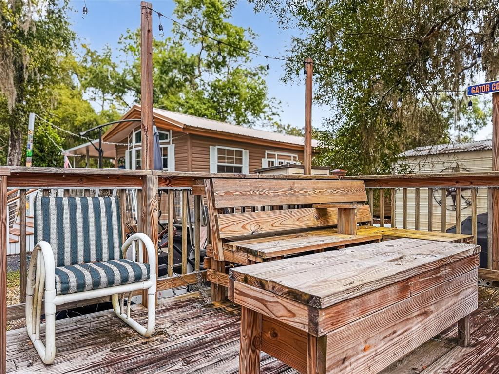 25184 Northeast 143rd Place Salt Springs, FL 32134 - Photo 25 of 42 a view of a roof deck with chair and wooden floor