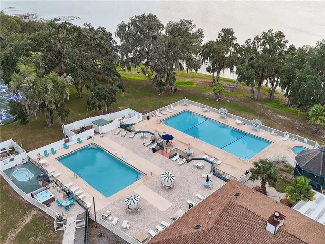 a view of a swimming pool with a patio