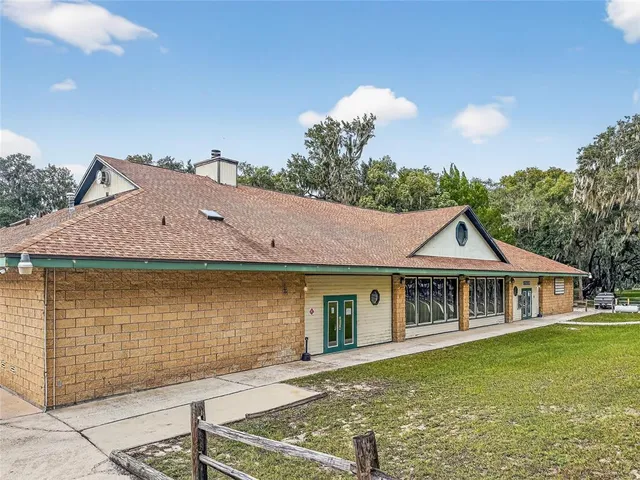a reading room with furniture and wooden floor