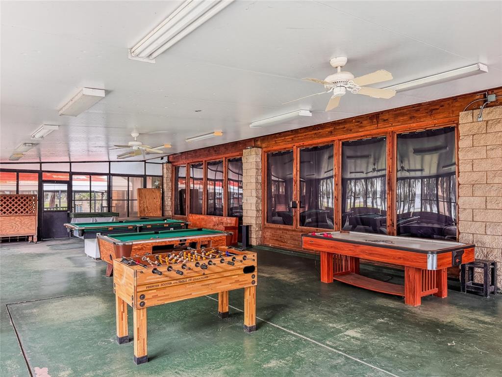 25184 Northeast 143rd Place Salt Springs, FL 32134 - Photo 38 of 42 a reading room with furniture and wooden floor