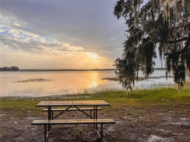 a view of wooden floor with a lake