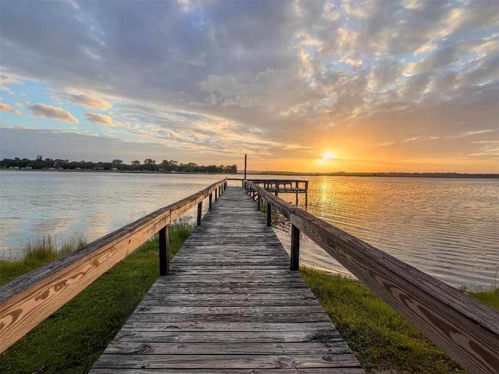 25184 Northeast 143rd Place Salt Springs, FL 32134 - Photo 40 of 42 a view of wooden floor with a lake