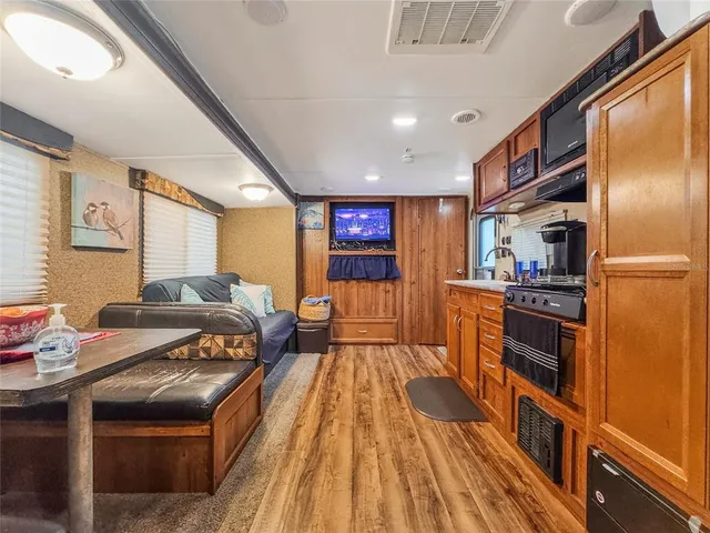 a kitchen with stainless steel appliances granite countertop a stove and a refrigerator