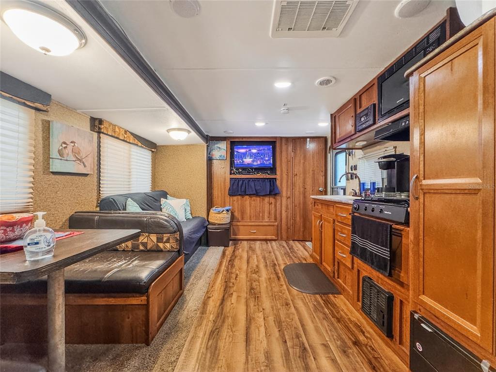 25184 Northeast 143rd Place Salt Springs, FL 32134 - Photo 5 of 42 a kitchen with stainless steel appliances granite countertop a stove and a refrigerator