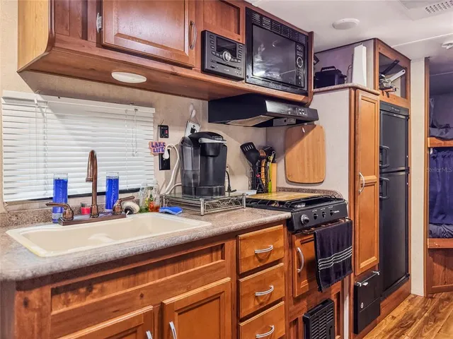a view of a kitchen with appliances and cabinets