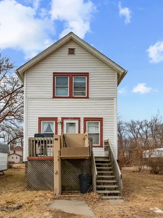 a front view of a house with stairs