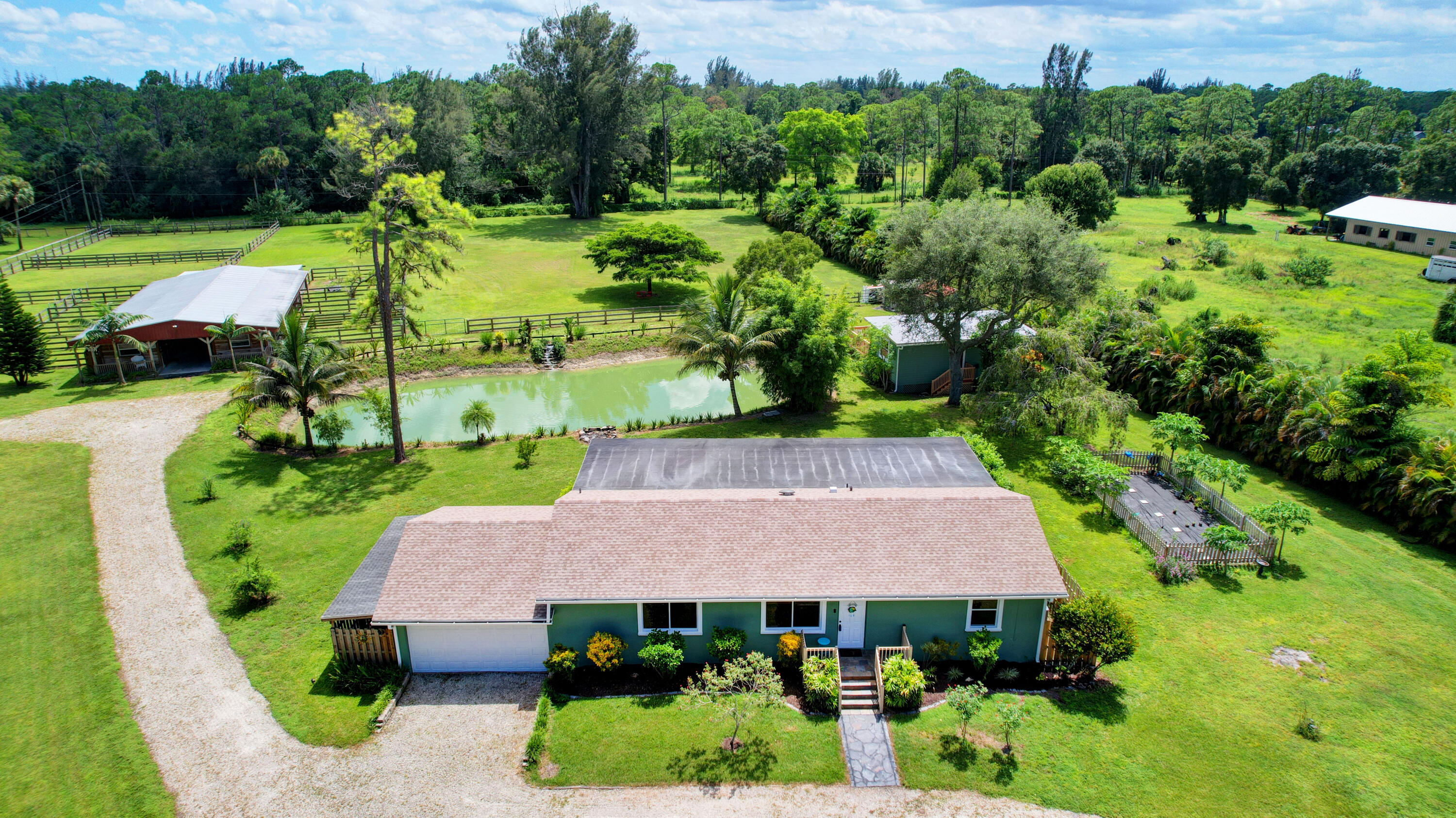 13598 N Road Loxahatchee Groves, FL 33470 - Photo 3 of 87 03_house air (3)
