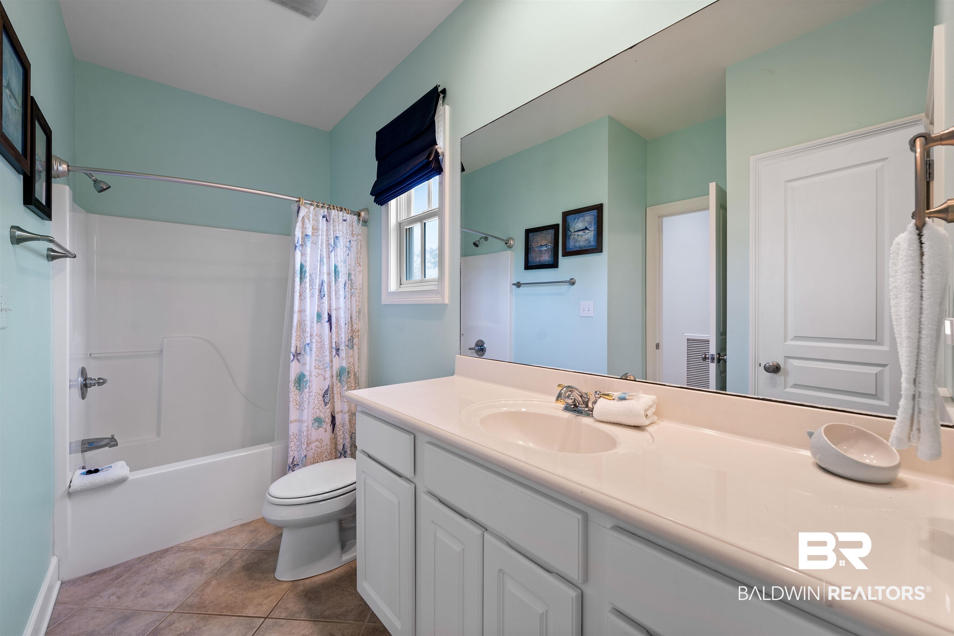 3434 Mariner Circle Orange Beach, AL 36561 - Photo 27 of 38 Full bathroom featuring shower / tub combo, tile patterned flooring, toilet, and vanity