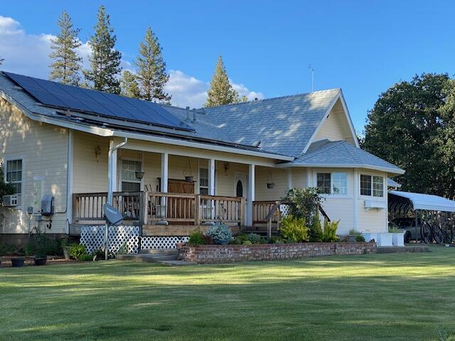 37268 Vedder Road Burney, CA 96013 - Photo 4 of 29 a front view of a house with a garden and swimming pool