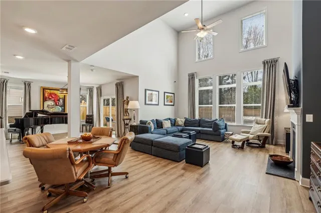 a living room with furniture window and wooden floor