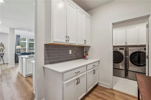 a utility room with dryer and washer