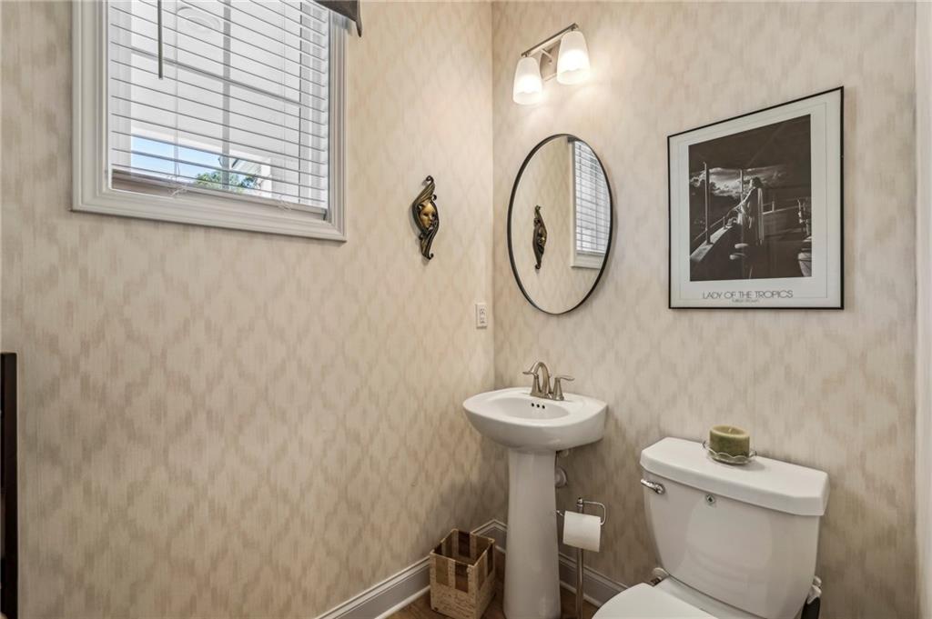4257 Freight Street Tucker, GA 30084 - Photo 18 of 41 a bathroom with a toilet sink and mirror