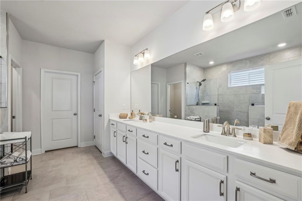 4257 Freight Street Tucker, GA 30084 - Photo 21 of 41 a bathroom with double sink and a mirror