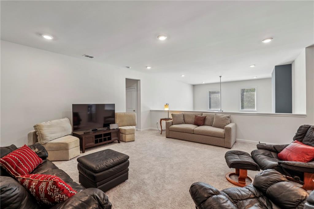 4257 Freight Street Tucker, GA 30084 - Photo 25 of 41 a living room with furniture and a flat screen tv