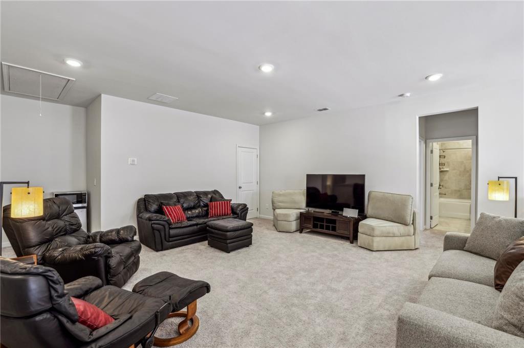 4257 Freight Street Tucker, GA 30084 - Photo 26 of 41 a living room with furniture and a flat screen tv