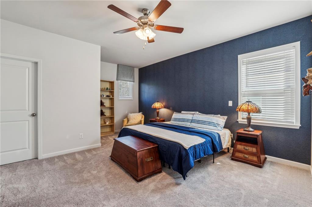 4257 Freight Street Tucker, GA 30084 - Photo 28 of 41 a bedroom with a bed and a chandelier