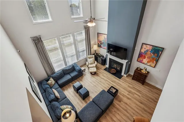 a bathroom with a bathtub shower sink vanity and toilet