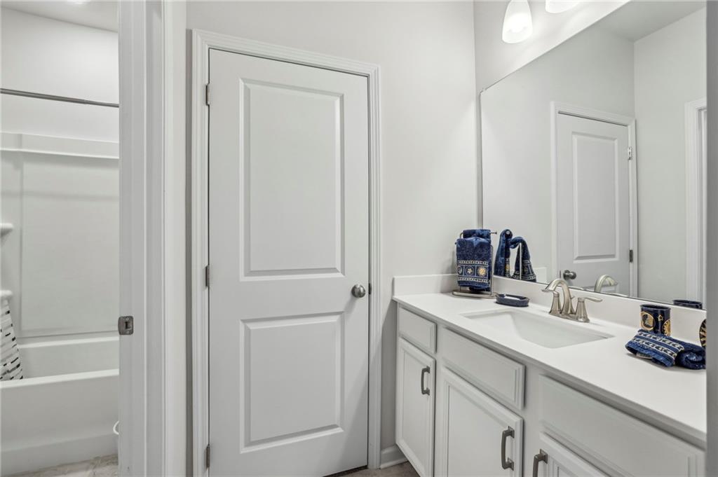 4257 Freight Street Tucker, GA 30084 - Photo 32 of 41 a bathroom with a sink and a mirror