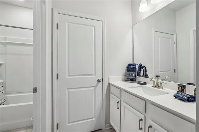 a bedroom with bed and window