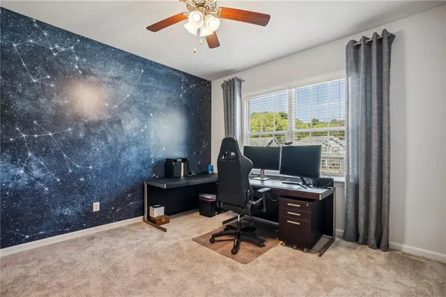 a bathroom with a sink vanity mirror and toilet