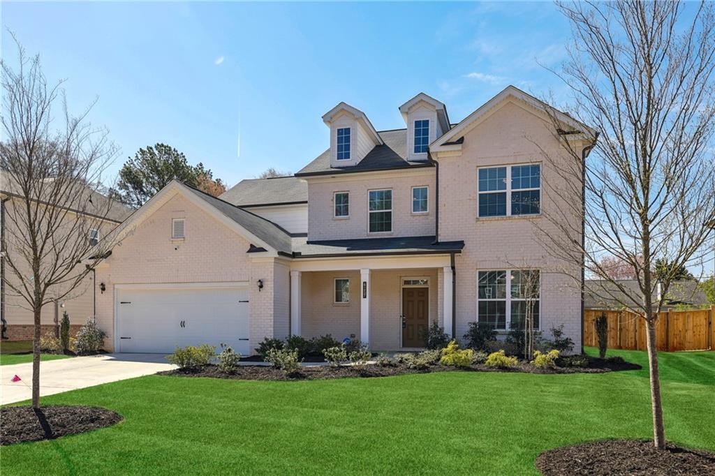 4257 Freight Street Tucker, GA 30084 - Photo 4 of 41 a front view of a house with a garden and plants