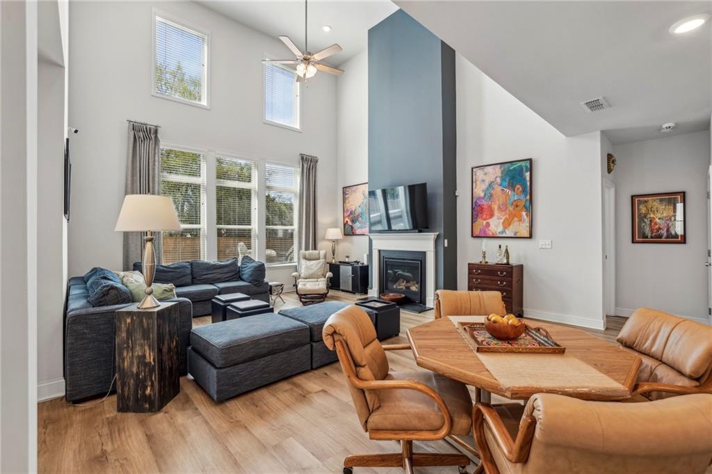 4257 Freight Street Tucker, GA 30084 - Photo 10 of 41 a living room with furniture a fireplace and a flat screen tv