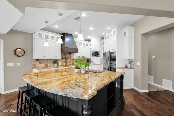 a living room with furniture a window and a chandelier