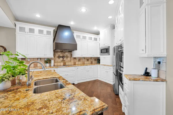 a living room with furniture and a large mirror