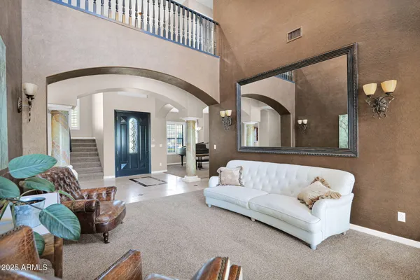 a bedroom with furniture and a chandelier