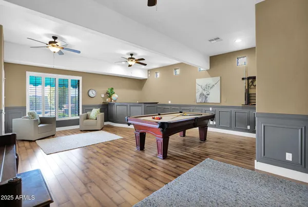 a bathroom with a bathtub and window