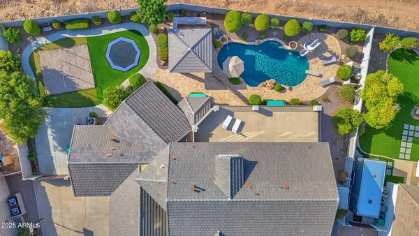 a view of a balcony with chairs and a table