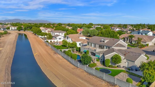 a kitchen with kitchen island a stove a table and chairs in it