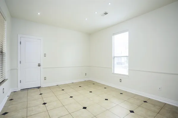 an empty room with white walls
