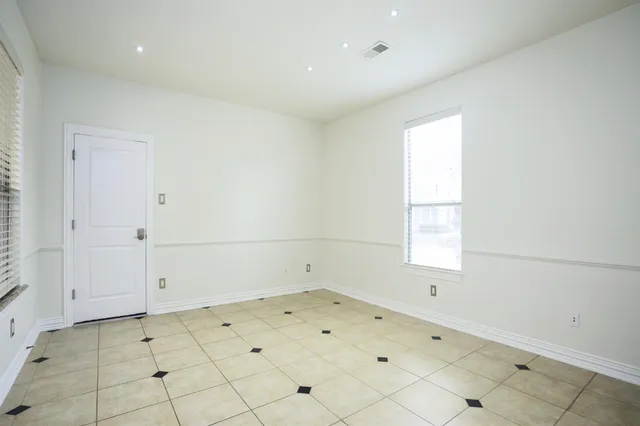an empty room with white walls