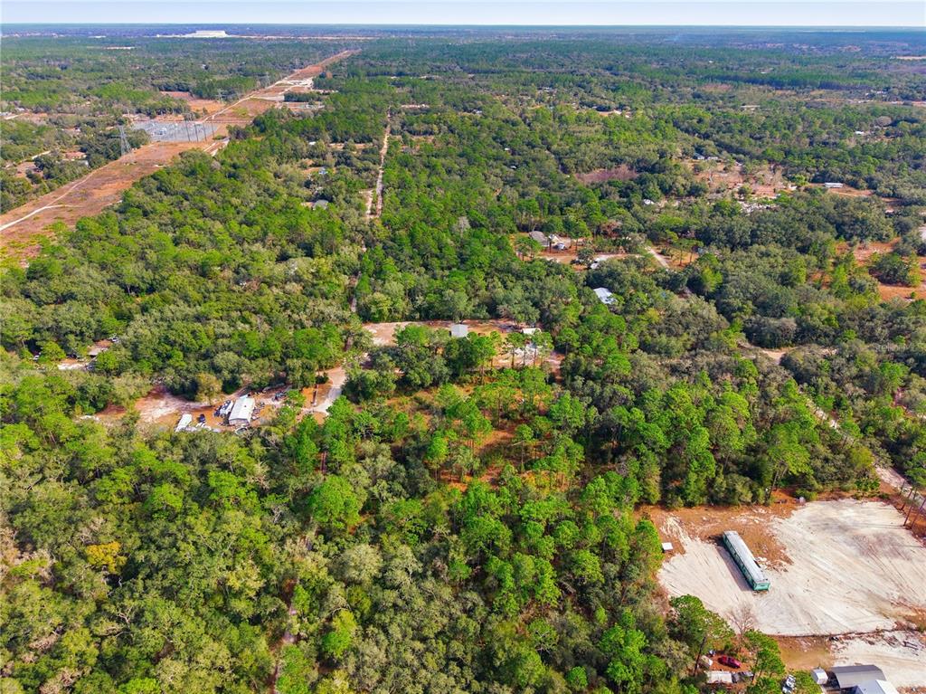 0 Southwest 151st Place Dunnellon, FL 34432 - Photo 12 of 18 an aerial view of residential houses with outdoor space and trees