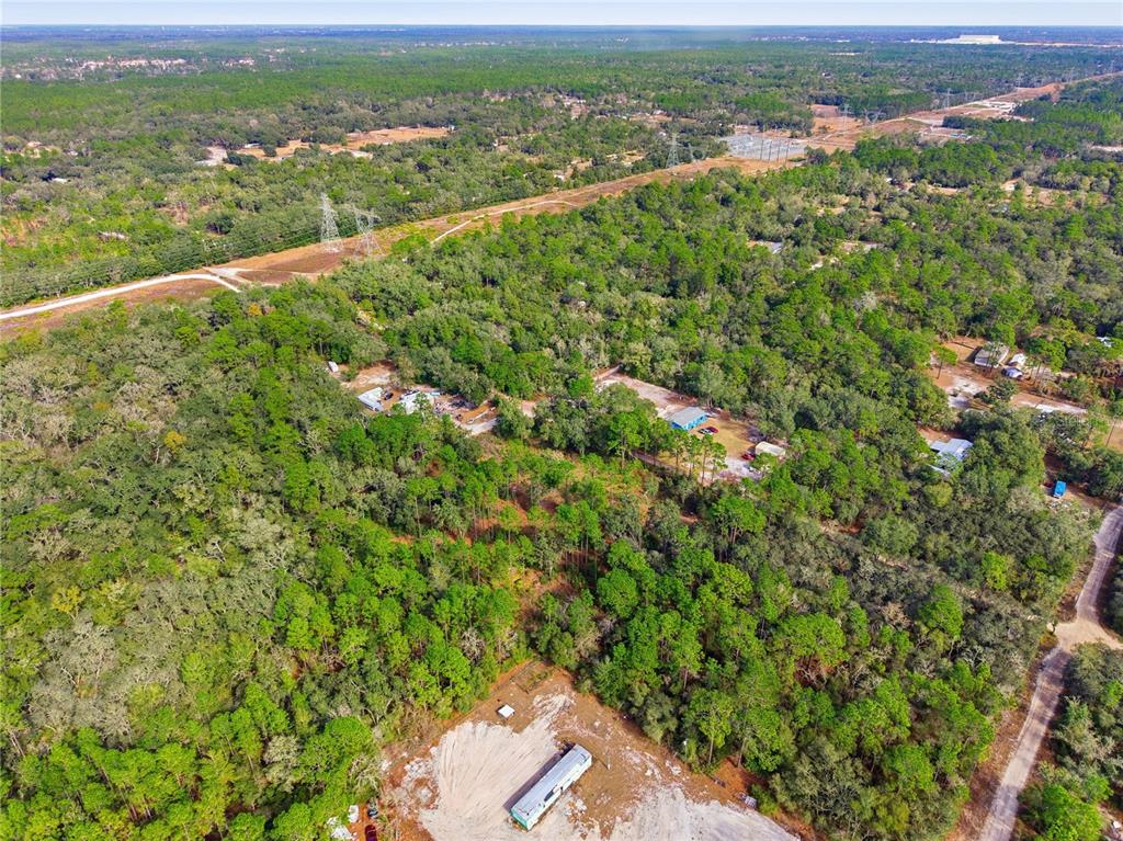 0 Southwest 151st Place Dunnellon, FL 34432 - Photo 14 of 18 an aerial view of residential houses with outdoor space and trees