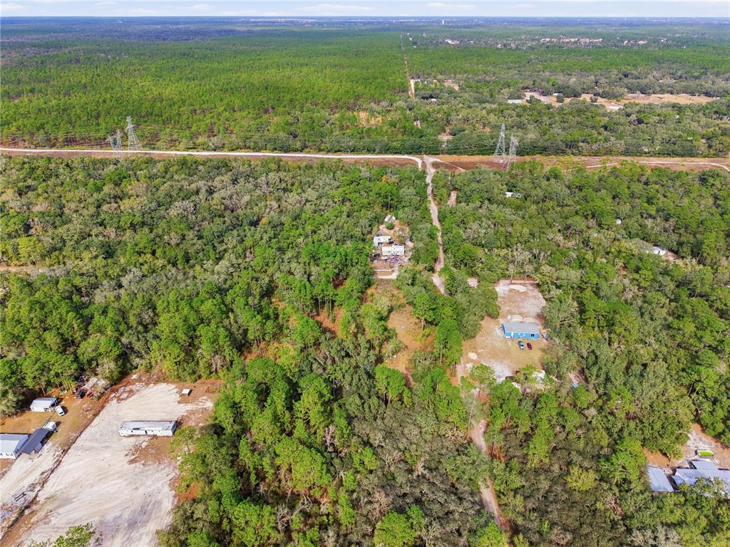 0 Southwest 151st Place Dunnellon, FL 34432 - Photo 18 of 18 a view of a city with lush green forest