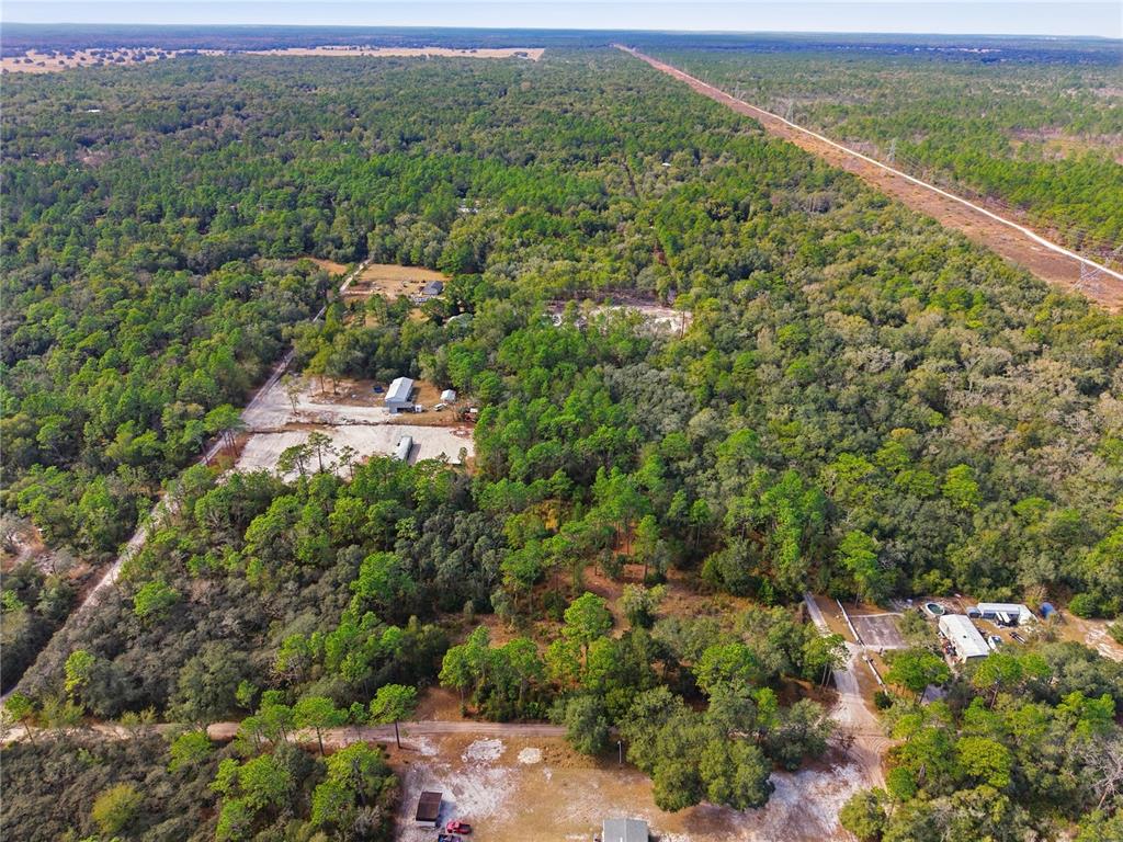 0 Southwest 151st Place Dunnellon, FL 34432 - Photo 6 of 18 an aerial view of residential houses with outdoor space and trees