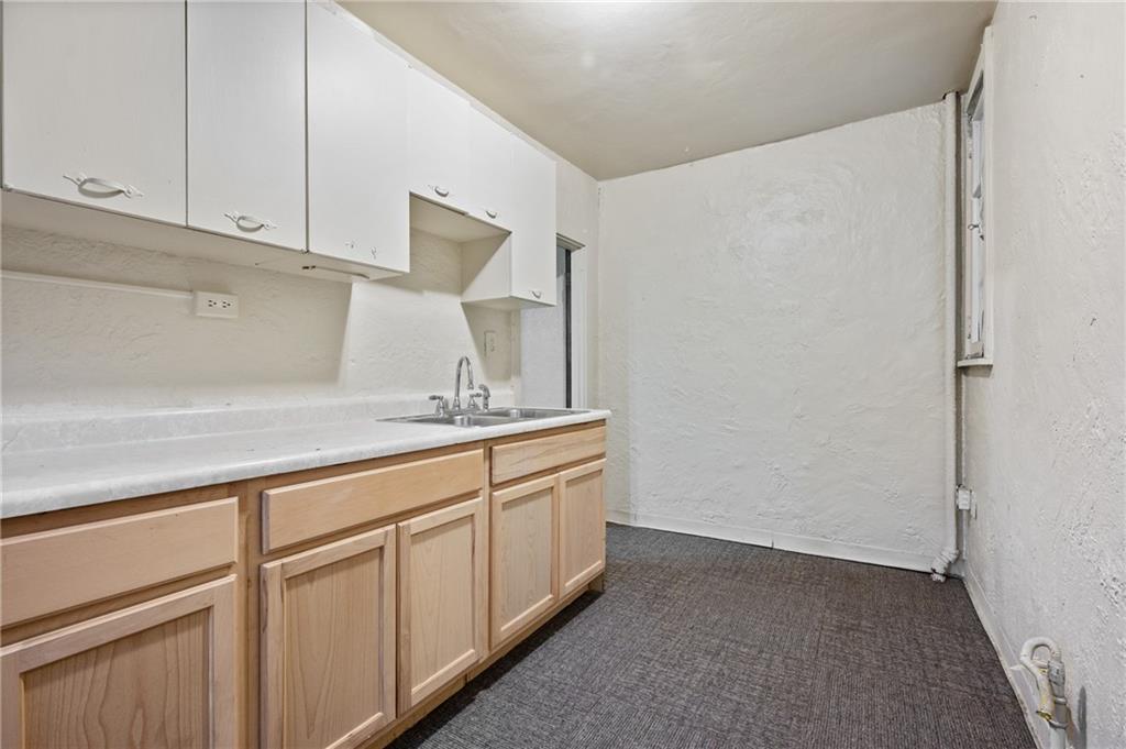 717 Center Pittsburgh, PA 15215 - Photo 11 of 20 a kitchen with white cabinets