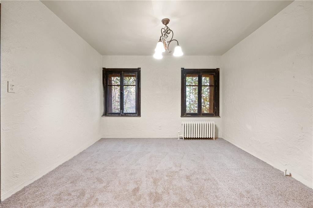 717 Center Pittsburgh, PA 15215 - Photo 3 of 20 an empty room with windows and closet