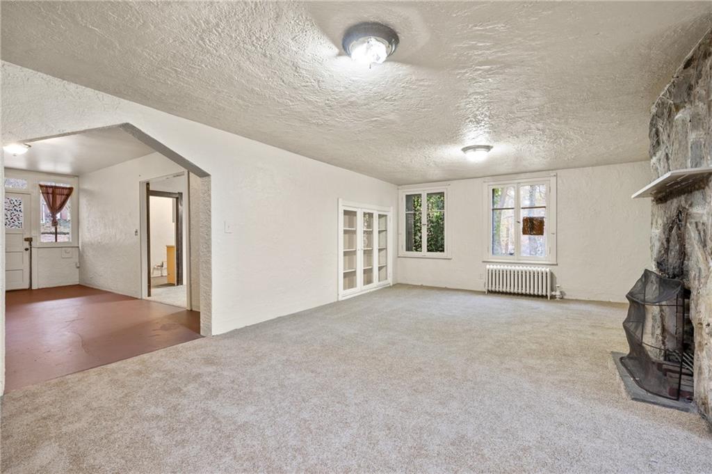 717 Center Pittsburgh, PA 15215 - Photo 4 of 20 an empty room with windows and entryway