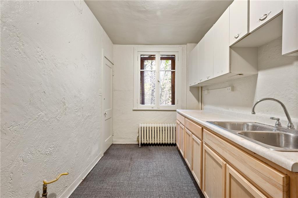 717 Center Pittsburgh, PA 15215 - Photo 9 of 20 a bathroom with a sink and a bathtub