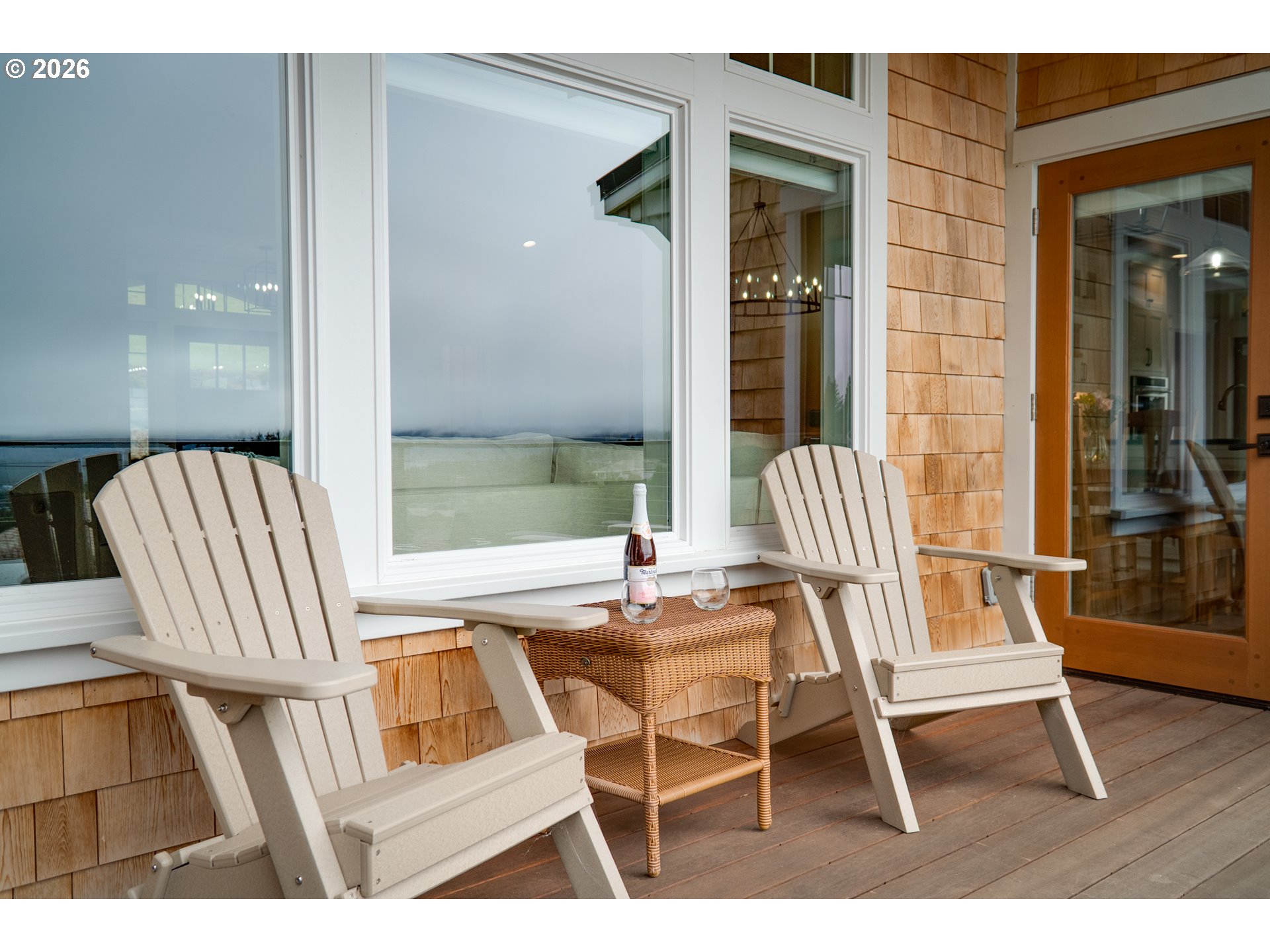 38590 Meadow Loop Nehalem, OR 97131 - Photo 12 of 48 a view of a chair and tables in the balcony